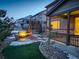 Evening view of backyard with fire pit and patio at 13717 Ashgrove Cir, Parker, CO 80134