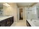 Elegant bathroom with double vanity, soaking tub and shower at 13717 Ashgrove Cir, Parker, CO 80134