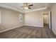 Large bedroom with carpeted floors and ceiling fan at 13717 Ashgrove Cir, Parker, CO 80134