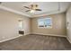 Spacious bedroom with ceiling fan and ensuite bathroom access at 13717 Ashgrove Cir, Parker, CO 80134