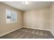 Bright bedroom with window, shutters, and carpet at 13717 Ashgrove Cir, Parker, CO 80134