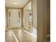 Light and airy entryway with tile floors and French doors at 13717 Ashgrove Cir, Parker, CO 80134