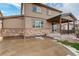 Two-story home with stone and siding exterior at 13717 Ashgrove Cir, Parker, CO 80134