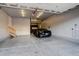 Finished garage with epoxy flooring and storage at 13717 Ashgrove Cir, Parker, CO 80134