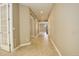 Long hallway with tile floors leading to other rooms at 13717 Ashgrove Cir, Parker, CO 80134