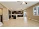 Spacious kitchen featuring dark cabinetry, an island, and tile flooring at 13717 Ashgrove Cir, Parker, CO 80134