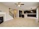 Open living room with tile floors, fireplace and staircase at 13717 Ashgrove Cir, Parker, CO 80134