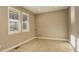 Neutral-toned office with tile floors and window shutters at 13717 Ashgrove Cir, Parker, CO 80134