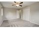 Large bedroom with ceiling fan, carpet, and double door closet at 1036 Lexington Ave, Westminster, CO 80023