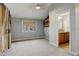 Bright bedroom with a ceiling fan, neutral walls, and attached bathroom at 1036 Lexington Ave, Westminster, CO 80023