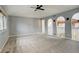 Spacious bedroom with ceiling fan and carpeted floors at 1036 Lexington Ave, Westminster, CO 80023