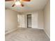 Bedroom with carpet, ceiling fan and access to bathroom at 1036 Lexington Ave, Westminster, CO 80023