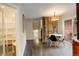 Bright dining area with rustic wood accent wall and modern table at 1036 Lexington Ave, Westminster, CO 80023