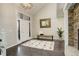 Modern entryway with dark hardwood floors and a bench at 1036 Lexington Ave, Westminster, CO 80023