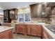 Updated kitchen with granite countertops and wood cabinetry at 1036 Lexington Ave, Westminster, CO 80023