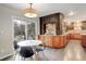 Charming breakfast nook adjacent to kitchen features a modern light fixture and sliding glass door at 1036 Lexington Ave, Westminster, CO 80023