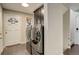 Entryway and laundry room with new front-loading washer and dryer at 1036 Lexington Ave, Westminster, CO 80023