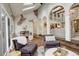 Sunroom with exposed brick wall and comfortable seating area at 1036 Lexington Ave, Westminster, CO 80023