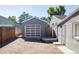 Modern garage with a white and gray door and ample parking space at 2774 W Irvington Pl, Denver, CO 80219