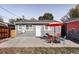 Back patio featuring a table, chairs, and an umbrella for comfortable outdoor seating at 2774 W Irvington Pl, Denver, CO 80219