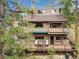 Beautiful multi-level home with a large deck, perfect for enjoying outdoor living amongst the surrounding trees at 4198 Timbervale Dr, Evergreen, CO 80439