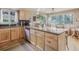 Spacious kitchen with granite counters, wood cabinets and stainless dishwasher at 4198 Timbervale Dr, Evergreen, CO 80439