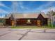Charming exterior view of a rustic outbuilding with unique architectural details and natural surroundings at 4198 Timbervale Dr, Evergreen, CO 80439