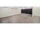 Finished basement with neutral carpet, black accent wall, and recessed lighting at 1111 Monroe St, Denver, CO 80206
