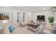 Cozy finished basement with a modern entertainment setup and neutral-toned decor at 1111 Monroe St, Denver, CO 80206