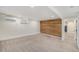 Finished basement featuring a plank accent wall, carpeted floor, and recessed lighting at 1111 Monroe St, Denver, CO 80206