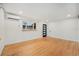 Bright and airy bedroom featuring hardwood floors, white walls, and a mini-split system at 1111 Monroe St, Denver, CO 80206