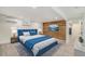 Comfortable bedroom featuring a plush bed, wood accent wall, and ample natural light, creating a serene retreat at 1111 Monroe St, Denver, CO 80206