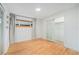 Serene bedroom with hardwood floors, large window, and closet with sliding door at 1111 Monroe St, Denver, CO 80206