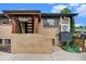 Charming brick home with a covered front entrance and modern door at 1111 Monroe St, Denver, CO 80206