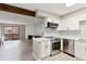 Modern kitchen with stainless steel appliances open to the living room at 3335 S Ammons St # 103, Lakewood, CO 80227