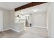 Bright white kitchen with stainless steel appliances and gray backsplash at 3335 S Ammons St # 103, Lakewood, CO 80227