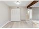 Spacious living room with neutral paint, updated laminate floors, and ample natural light at 3335 S Ammons St # 103, Lakewood, CO 80227
