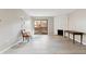 Bright and open living area with fireplace, and glass sliding doors at 3335 S Ammons St # 103, Lakewood, CO 80227