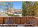 Relaxing patio view of the backyard featuring mature bushes at 3335 S Ammons St # 103, Lakewood, CO 80227