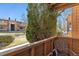 Second story patio view looking out on the grass and other units in the community at 3335 S Ammons St # 103, Lakewood, CO 80227