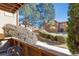 Second story patio view looking out on the grass, shrubs and walking path of the community at 3335 S Ammons St # 103, Lakewood, CO 80227