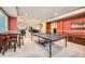 Spacious finished basement with ping pong table and room for entertaining at 13901 Quail Ridge Dr, Broomfield, CO 80020