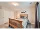 Bright bedroom featuring a light wood bed frame, neutral tones, closet doors, and a decorative shelf adding character at 13901 Quail Ridge Dr, Broomfield, CO 80020