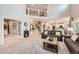 Open-concept living room features high ceilings and neutral colors that create a welcoming atmosphere at 13901 Quail Ridge Dr, Broomfield, CO 80020