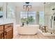 This spacious primary bathroom features a standalone tub, walk-in shower, and stylish pendant lighting at 13901 Quail Ridge Dr, Broomfield, CO 80020