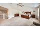 Large primary bedroom includes vaulted ceilings, ensuite bathroom, walk-in closet, and neutral-toned walls at 13901 Quail Ridge Dr, Broomfield, CO 80020