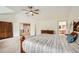 Bright primary bedroom boasts vaulted ceilings, a ceiling fan, with an ensuite bathroom and walk-in closet at 13901 Quail Ridge Dr, Broomfield, CO 80020