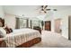 Spacious primary bedroom features vaulted ceilings, a ceiling fan, large windows, and ample natural light at 13901 Quail Ridge Dr, Broomfield, CO 80020