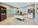 Home office with blue walls, built-in bookshelves, a large desk, and natural light at 13901 Quail Ridge Dr, Broomfield, CO 80020