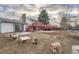 Expansive backyard features a large wooden deck, mature trees, and ample space for outdoor activities at 16333 E Carolina Dr, Aurora, CO 80017